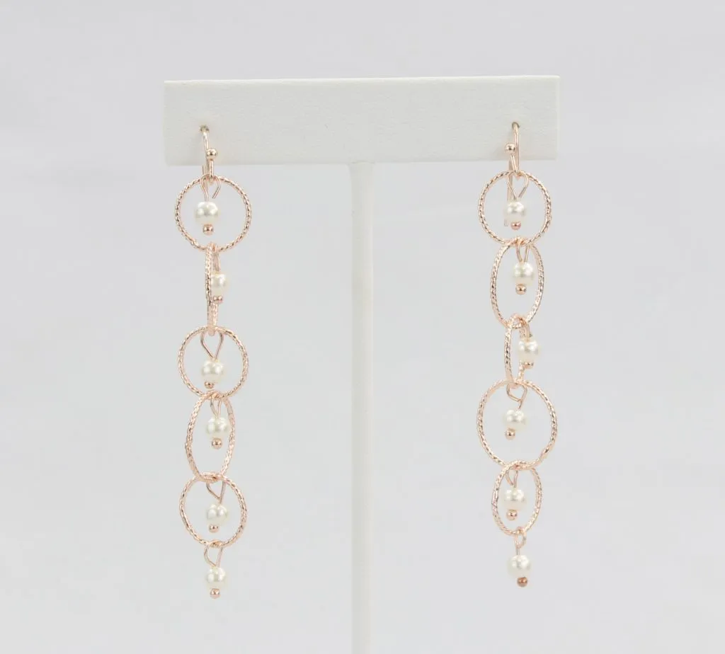Rose gold linked hoop and pearl earrings